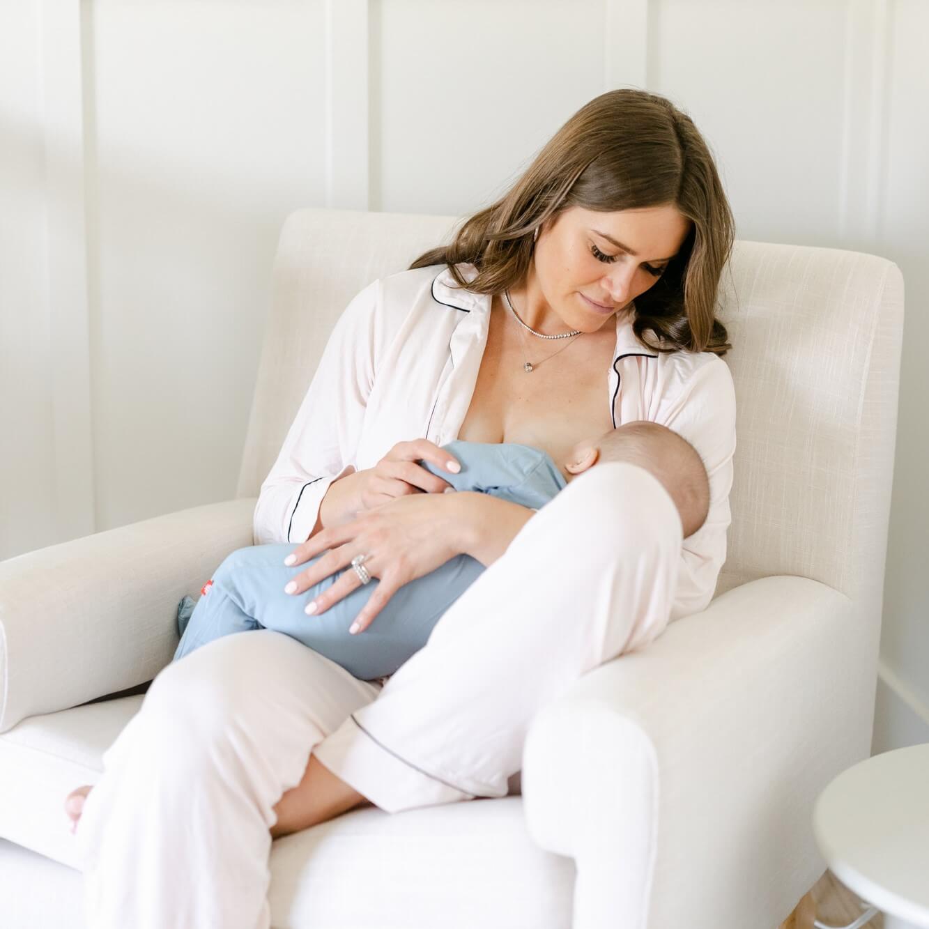 woman breastfeeding child